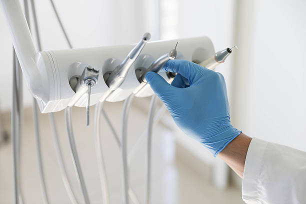 Professional Tooth Extraction technician working in College Station, TX